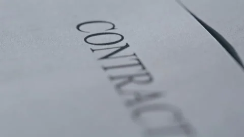 Macro view business contract placed on desk indoors. Legal document lying office Stock Footage 332416365