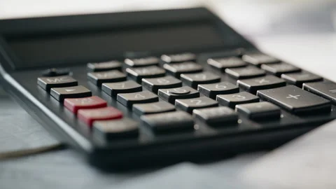 Macro view calculator lying on desk. Counting device at cabinet table closeup Stock Footage 332416167