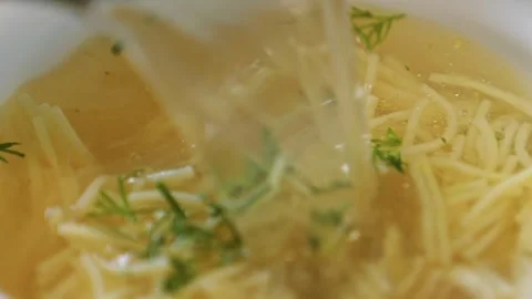 Macro view: The chicken bouillon with noodles, dill and chicken meat . Stock Footage 244484272