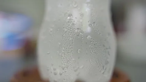 Macro View of Cold Plastic Bottle Covered With Water Condensation Droplets, Fres Stock Footage 339196216