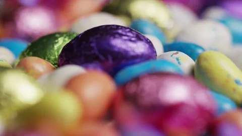 Macro view of colorful chocolate easter eggs in pile Stock Footage 327829429