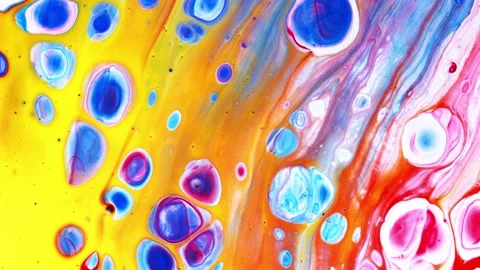 Macro view of colorful patterns moving around in liquid for background Stock Footage 143358818