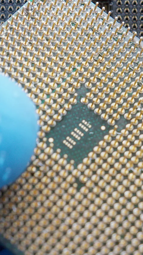 Macro view of a computer processor (CPU) being carefully held with gloves, .. Stock Footage 311342079