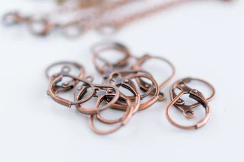 Macro view copper earring hooks. Craft supplies. Stock Photos