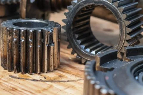Macro View Of Damaged Transmission Planetary Pinion Gear Next To Internal S.. Stock Photos