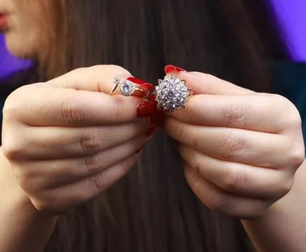 Macro view of diamond-inspired ring with round-cut stones Stock Photos