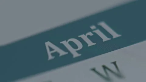 Macro view of digital calendar on mobile phone screen with April month name Stock Footage 288963944