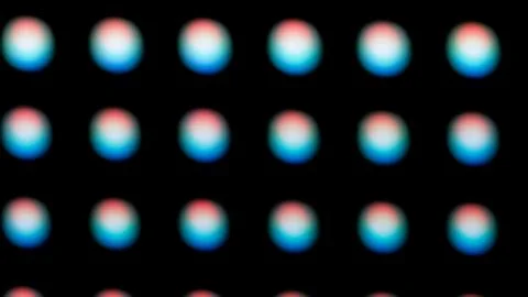 Macro View of a Digital LED Panel with RGB Pixel Grid Foto stock