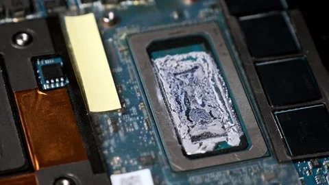 Macro View of Dried Thermal Paste on a Computer Processor Stock Footage 313860768