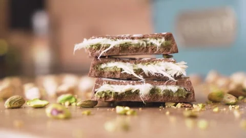Macro view of Dubai chocolate and pistachio topping Stock Footage 313545694