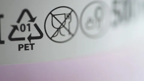 Macro view of eco labeling and recycling marks on product packaging spbd. Stock Footage 135783982