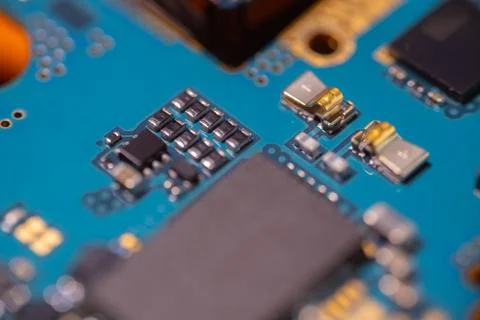 Macro view of electronic circuit board with blue substrate, integrated chip.. Stock-Fotos