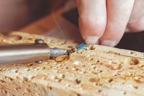 Macro view of engineer solding process in his workshops Stock Photos