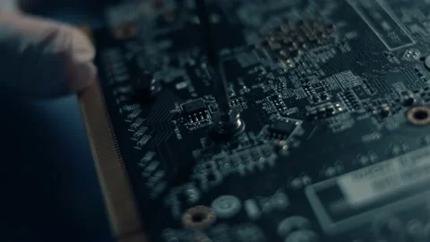 Macro view of engineer's hand screwing the screw with screwdriver on GPU graphic Stock Footage 145776163