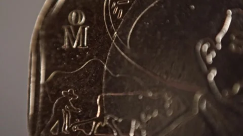 Macro View of Engraved Portrait on Coin Surface with Metallic Texture and Detail Stock Footage 338413873