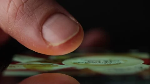 Macro view of a finger doom scrolling social media or browsing internet Stock Footage 234663204