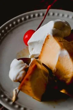 Macro View of Flan Custard Pudding Slice with Whipped Cream Stock Photos