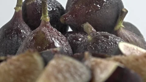 Macro View of Fresh Purple Fig With Water Drops on Wet Textured Skin Stock Footage 345365500