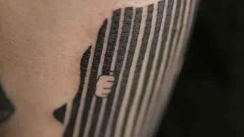 Macro view on fresh tattoo on hand of man Stock Footage 102813078