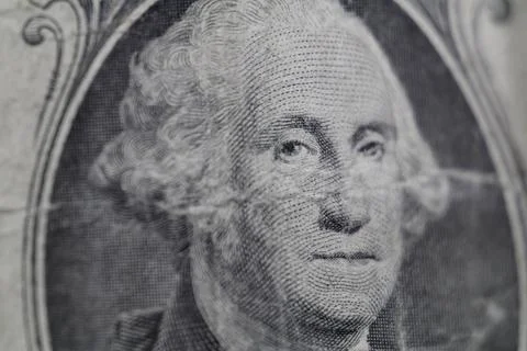 Macro view of George Washington on worn out dirty US one dollar bill. Foto stock