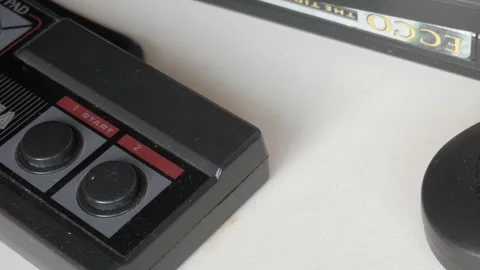 Macro view gliding over blue and black video game controller and video game Stock Footage 344141854
