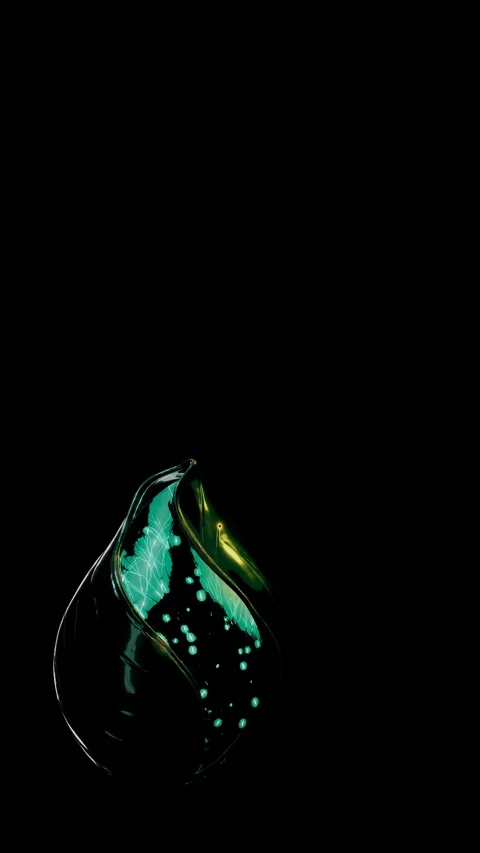 Macro View of a Glowing Emerald Fluid Capsule, Vertical Video 9:16 4K Stock-Footage 336525995