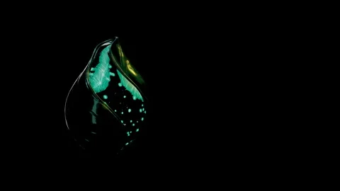 Macro View of a Glowing Emerald Fluid Capsule, 4K ProRes 422 HQ Stock-Footage 336526128