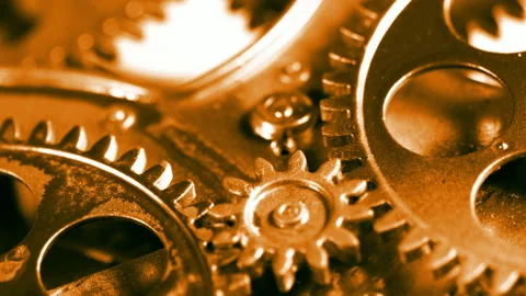 Macro View of Golden Interlocking Mechanical Gears Stock Footage 332879071