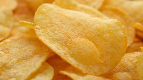Macro view golden potato chips, rotation Stock-Footage 245530381