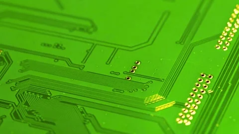 Macro view of green electronic circuit board with golden metal contacts Stock Footage 340355944