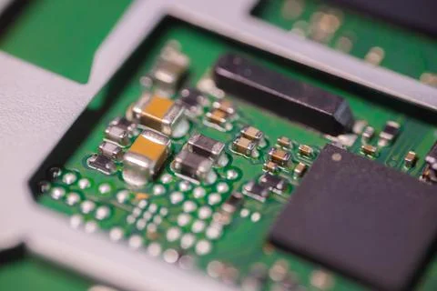 Macro view of green printed circuit board with electronic components, solde.. Stock Photos