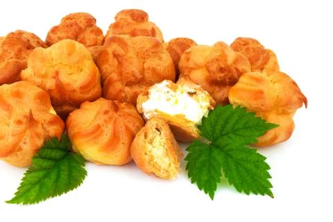 Macro view of group baked eclair, custard, cake, profiterole, bread with gree Stock Photos