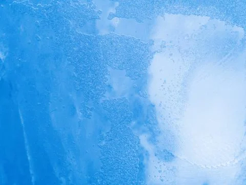 Macro view to ice pattern. Close up shot. Soft focus. Blue gradient background Stock Photos