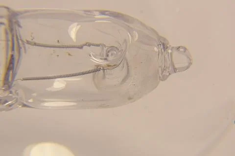 Macro view of the inner halogen capsule with tungsten filament Fotos Stock