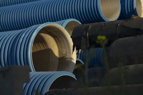 Macro view of inside drainage pipe showcasing pattern and shadow effects Stock Photos