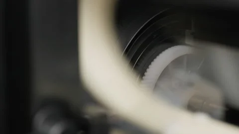 Macro view inside a working inkjet printer, moving gears. Stock Footage 276816952