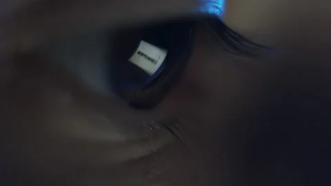 Macro view of laptop screen reflection in brown human eye. Surfing internet Stock Footage 157021063