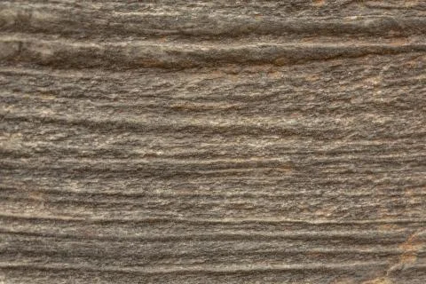 Macro view on the lines and texture of an old weathered piece of stone Fotos de archivo