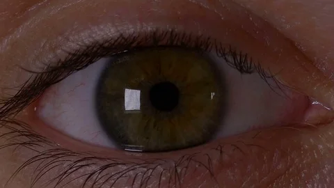 Macro view of man eye opening in slow motion and feeling surprised Stock Footage 75637537