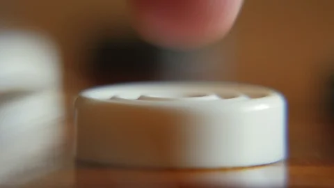 Macro view of man's finger with checkers in shallow depths of field 動画素材 104933122
