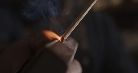 Macro view of a match being lit on a matchbox Stock-Footage 201304552