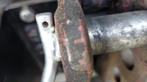 Macro view of metal hitch pin with linchpin locking mechanism on farm machinery 動画素材 346245732