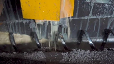 Macro view of metalworking process with coolant on industrial cutting tool Stock Footage 306179724