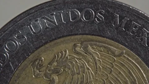 Macro view of Mexican coin with eagle emblem and Estados Unidos Mexicanos Stock Footage 343712142