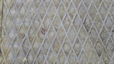 Macro View of Orange Oxidation on Diamond Plate Steel featuring a Non-Slip Stock Footage 328645591