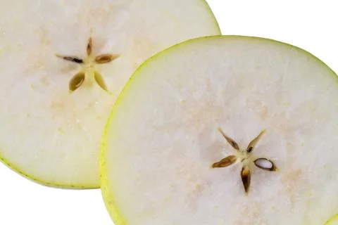 Macro view of pear slice. Nice background of cut fresh pear with seeds Stock Photos