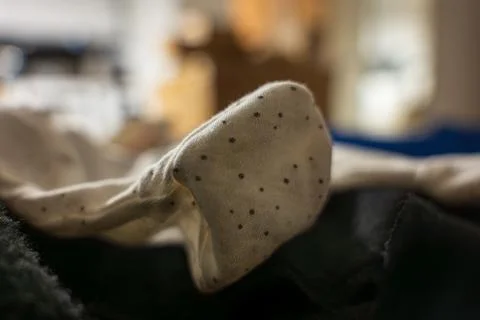 Macro view of polka dot sock toe with stitching detail, Poland Foto stock