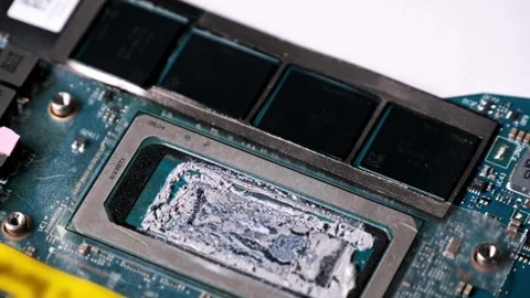 Macro View of a Processor with Liquid Metal Thermal Paste Stock Footage 314076419