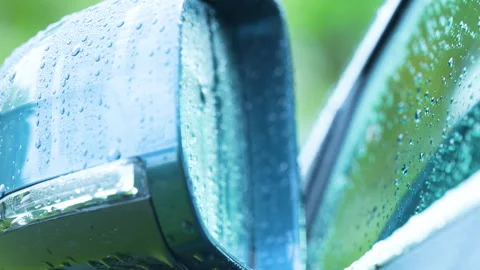Macro View Raindrops On Blue Car Side Mirror During Rain Stock Footage 345442553