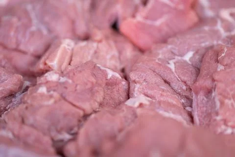 Macro view raw pork meat texture highlighting marbling and fiber detail, cl.. Stock Photos